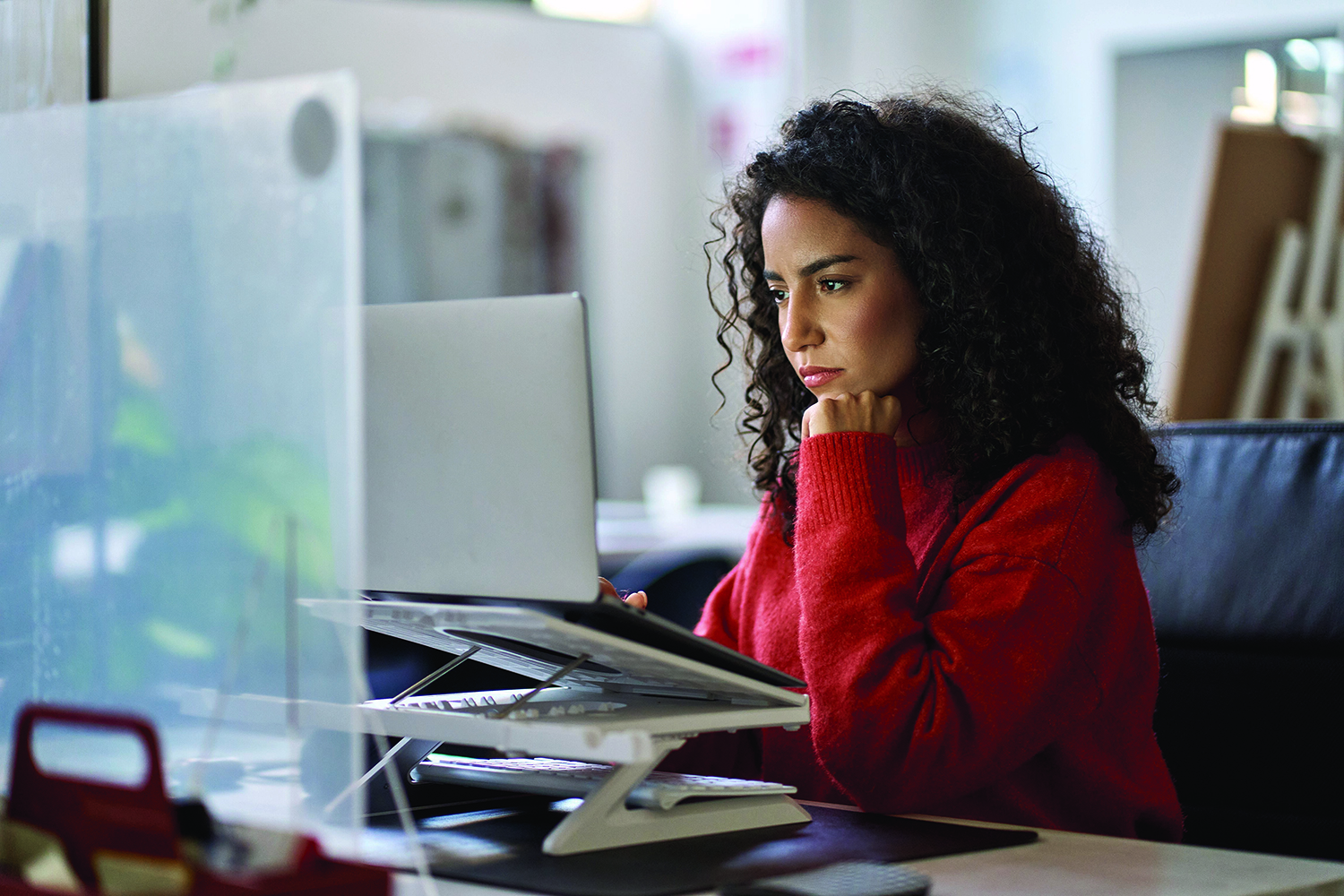 Woman working looking at laptop screen